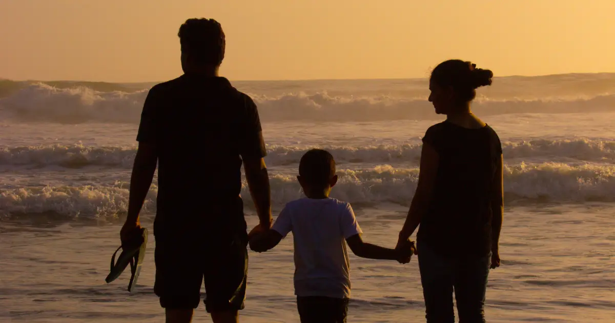 A diverse group of people illustrating agape love by displaying acts of kindness and unity in a peaceful park setting. Relationships - Agape Love Meaning