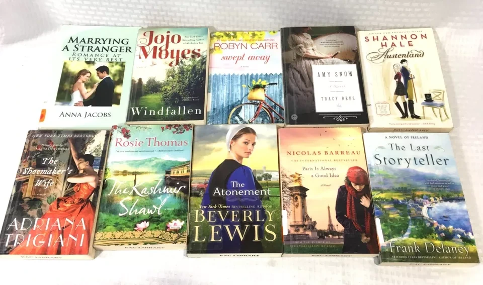 Person reading one of many captivating love story books